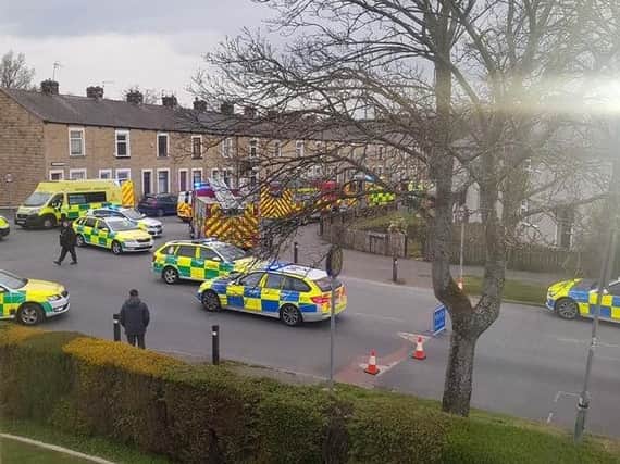 This photograph taken by Chris Carroll shows police and paramedics at the scene of the road accident in Barden Lane, Burnley earlier this evening.