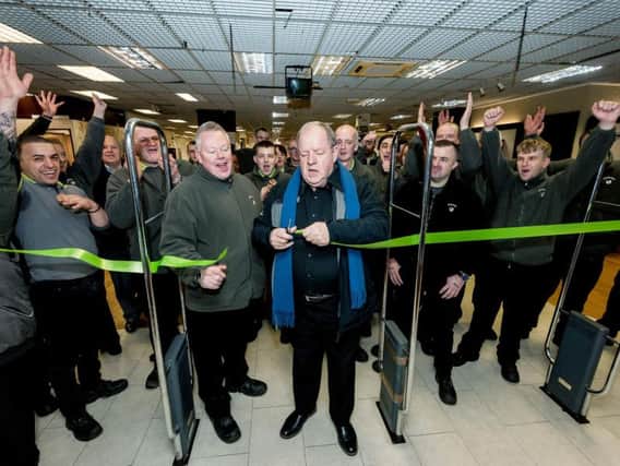 Actor and Emmaus ambassador John Henshaw cutting the ribbon at the new Rochdale store