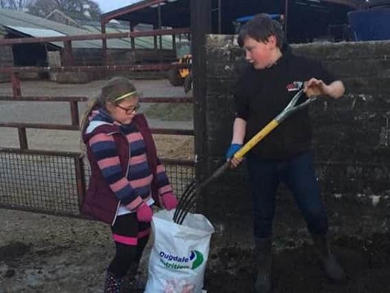 Valley youngsters hard at work for the annual Muck Haul event