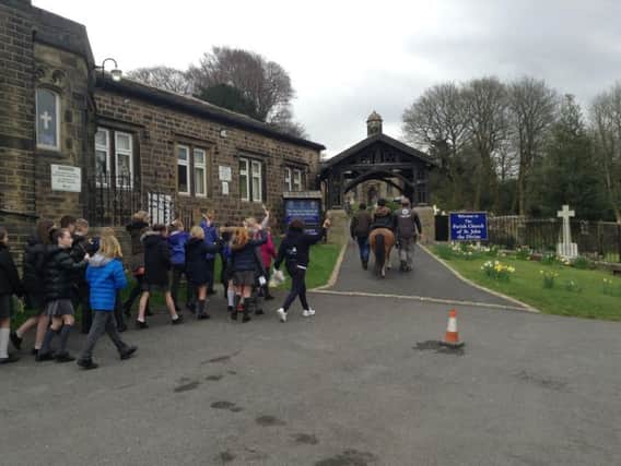 The pupils make their way to church