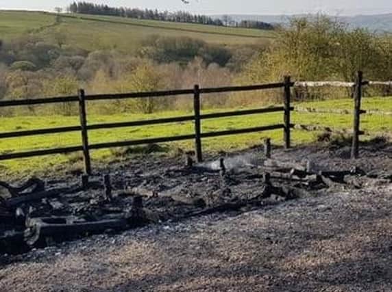 The remains of the newly erected viewing platform in  Briercliffe after arsonists torched it last Friday.