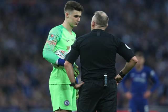 Chelsea's Kepa Arrizabalaga and referee Jon Moss