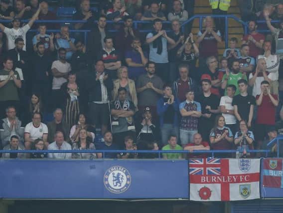 Clarets fans cheer on the lads away at Stamford Bridge. Photo: Rob Newell/CameraSport