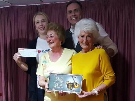 Strutting their stuff for charity are Cactus Line Dancing Club founder and teacher Pam Hart (front left) with Rosemere Cancer Foundations East Lancs fund-raising co-ordinator Louise Grant (back left), club member June Kay and line dance artist Derek Darby