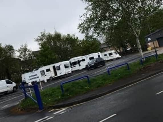 The convoy of caravans on Boyes store car park in Padiham this afternoon.