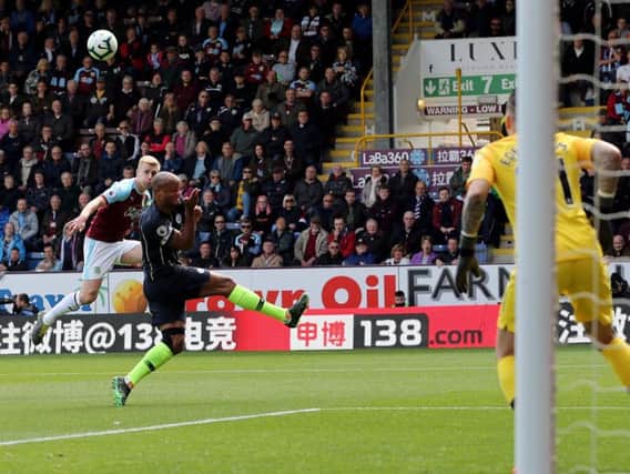 Ben Mee lifts a first half volley over
