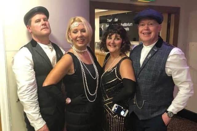 These two couples are ready 1920s style for the Peaky Blinders themed night.