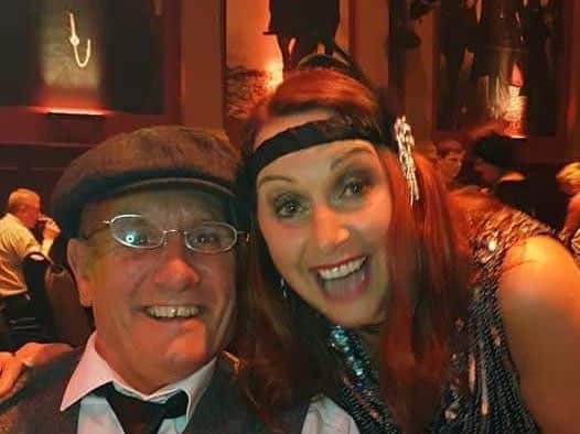 Two guests pose for the camera at the Peaky Blinders charity night.