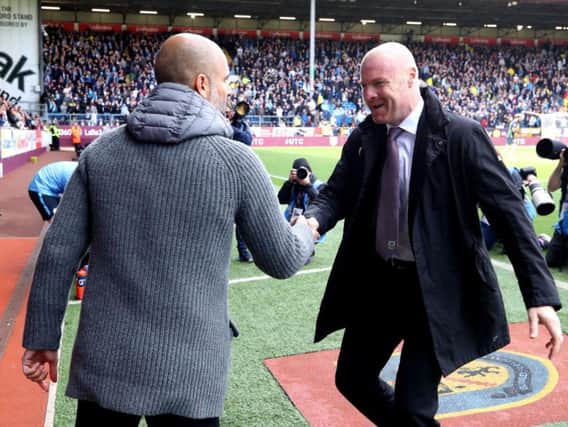 Burnley manager Sean Dyche (right) has led Burnley FC for their latest period of growth, which has seen the side ranked as the seventh-most valuable in the division.