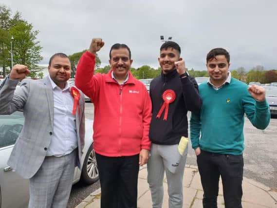 Labour's Coun. Mohammed Iqbal (red top) celebrates a good day for Pendle Labour
