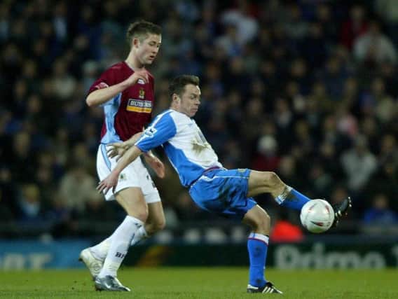 Gary Cahill holds off Paul Dickov while on loan with Burnley