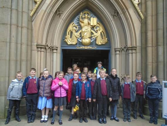 The pupils at the entrance to the cathedral.