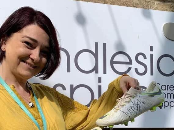 Chris Woods has kindly donated a pair of signed boots to the Razzle and Dazzle charity ball