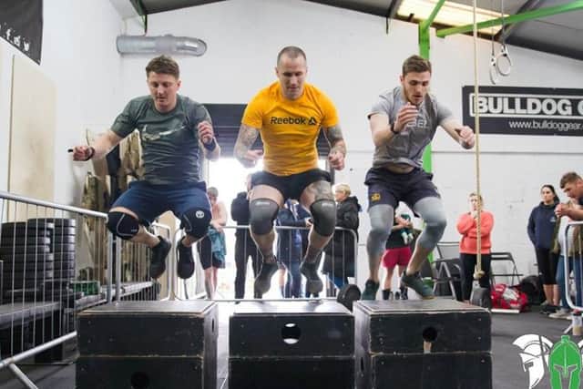Competitors at CrossFit Pendles Only The Brave competition doing synchronised box jumps