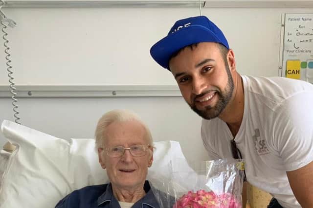 Amer with a patient at the Royal Blackburn Hospital