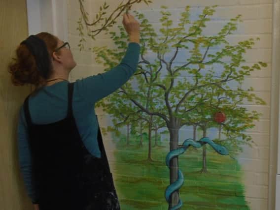 Artist Ursula Hurst at work at Burnley's Holy Trinity Primary School.