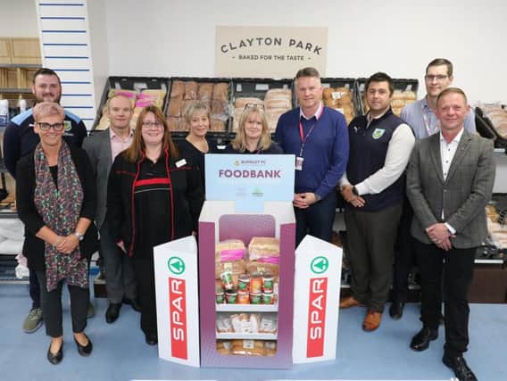 Representatives of SPAR and Clayton Park Farm bakery pictured with staff at the Burnley Community Kitchen.