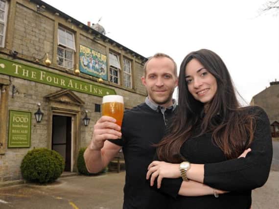New landlord of The Four Alls, Michael Bann, toasts his return with partner Marina Palazon
