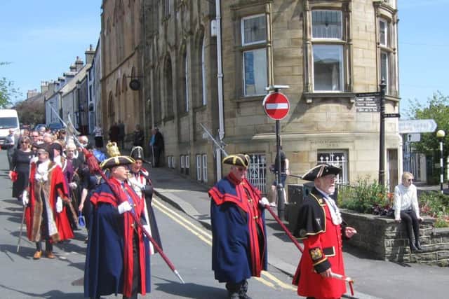 The procession to and from the historic Moot Hall.