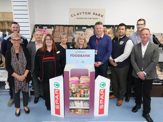 Representatives from Burnley Community Kitchen, Clayton Park Bakery, James Hall & Co. and staff from SPAR Padiham Road, where a new foodbank initiative was first trialled. (s)