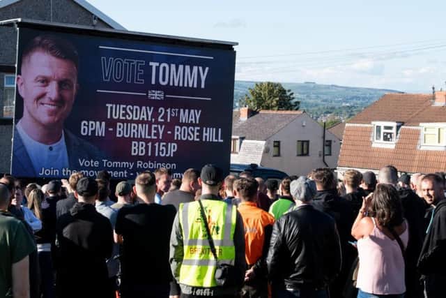 Crowds gathered last night to listen to Tommy Robinson, who is due to stand in the European elections tomorrow, when he arrived in Burnley.