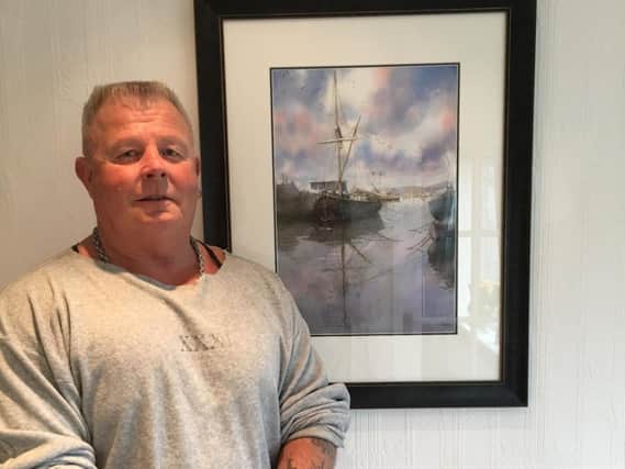 John Parker, a former professional bodybuilder, with one of his stunning watercolour paintings, which are inspired by nature and the Lancashire landscape. (s)