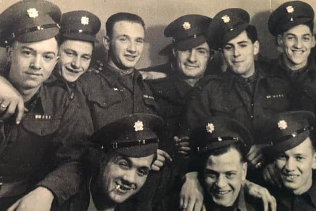 Ted (third from the top left) with comrades.