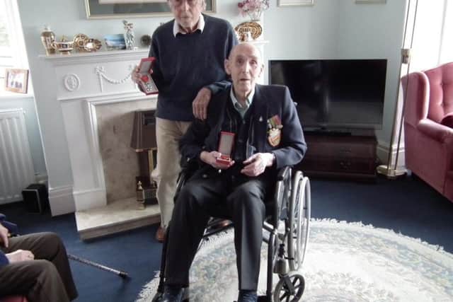 Ralph Woolnough (left) with his Legion of Honour medal, along with Foulridge D-Day veteran, Charles Webb.