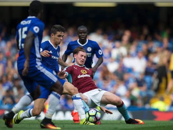 Aiden O'Neill is challenged by Chelsea's Oscar and N'Golo Kante