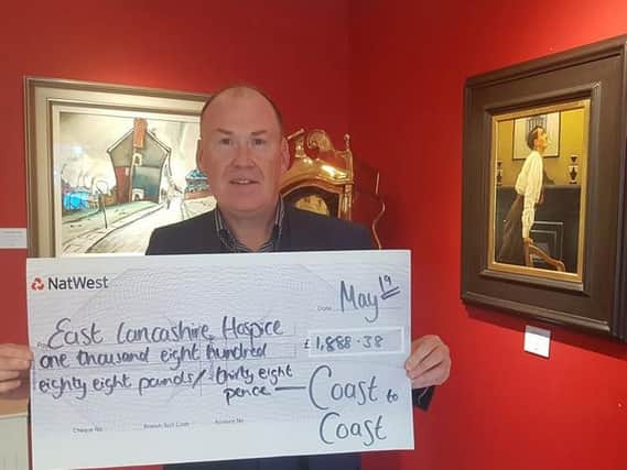 Chris McCabe proud to handover the cheque.
