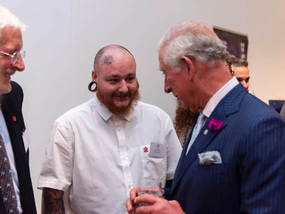 Scott chats with Prince Charles about how the Prince's Trust has helped him to launch his own tattoo business.