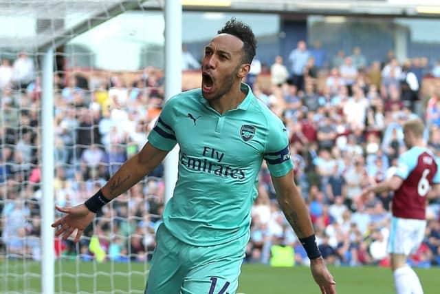 Arsenal's Pierre-Emerick Aubameyang celebrates scoring his side's first goal of the game during the Premier League match at Turf Moor, Burnley. PRESS ASSOCIATION Photo. Picture date: Sunday May 12, 2019. See PA story SOCCER Burnley. Photo credit should read: Nigel French/PA Wire. RESTRICTIONS: EDITORIAL USE ONLY No use with unauthorised audio, video, data, fixture lists, club/league logos or "live" services. Online in-match use limited to 120 images, no video emulation. No use in betting, games or single club/league/player publications.