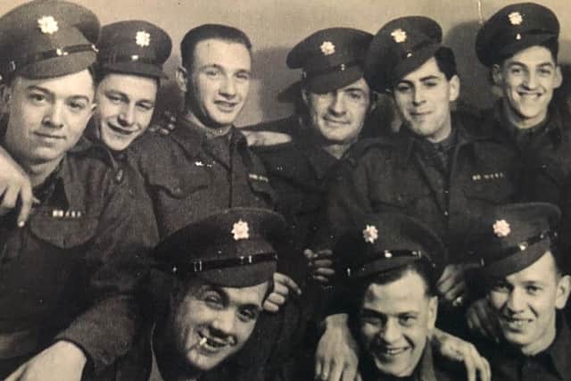 Ted (top, third from left) with his comrades.