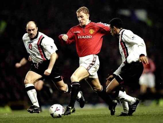 Steve Stone in pursuit of Manchester United's Nicky Butt at Old Trafford in 1998.