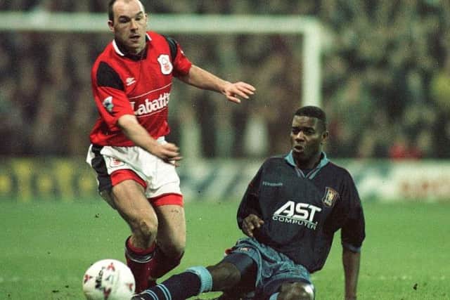 Aston Villa's Ian Taylor tackles Steve Stone of Nottingham Forest in an FA Cup tie in 1996.
