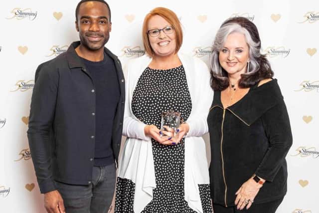 Jennifer receives her award from Margaret Miles-Bramwell OBE and TV presenter Ore Oduba