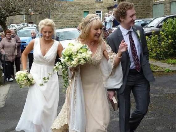Paula Helm, who died five years ago at the age of 49, on her wedding day to her husband Graham with her daughter Chloe and son Laurence.