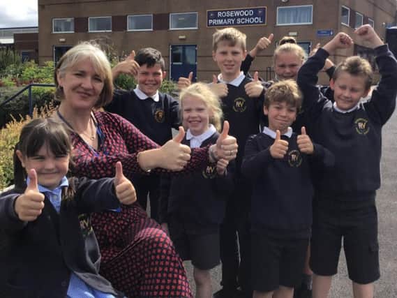 Rosewood Primary School pupils celebrate a 'good' Ofsted report with headteacher Nerys Ditchburn-Hughes