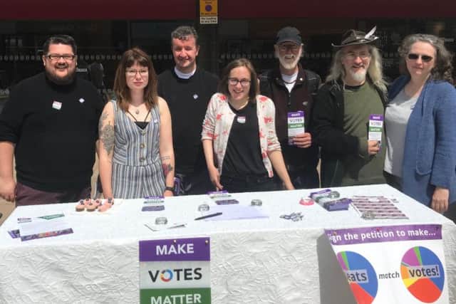 Members of Burnley Green Party took their campaign calling for a fairer voting system on the road in the town centre.