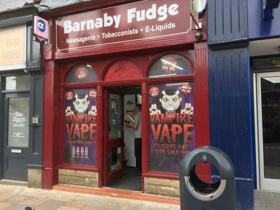 Popular Burnley town centre shop Barnaby Fudge was one of two town centre shops targeted by raiders this week who made off with cigarettes and cash.