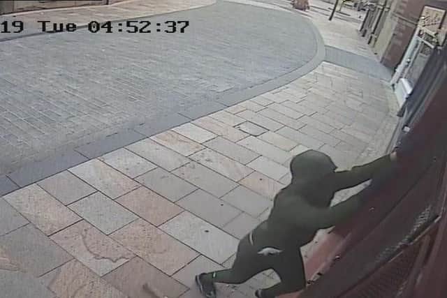 This still image is taken from the CCTV footage of the raider who broke into Barnaby Fudge in St James Street, Burnley.