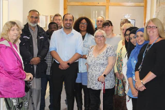 Dr Zulqarnain Shah with staff and the public at Colne Road Surgerys first 'conversation cafe'