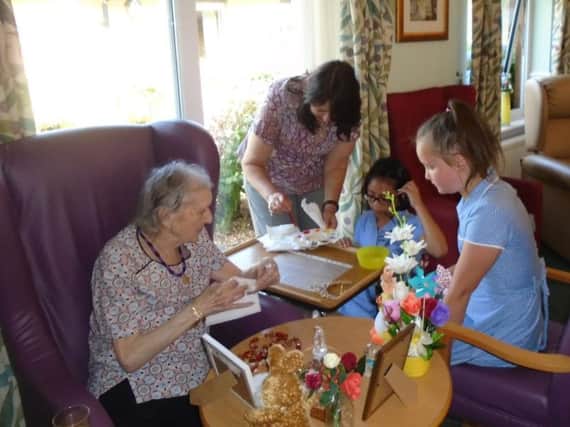 Schoolchildren, staff and residents at Dove Court