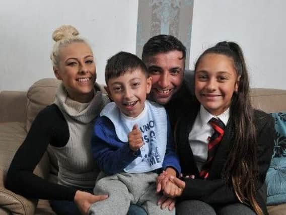 Big hearted dad Tariq Khan with his wife Kirsty and their children Kalam, who is almost 10 and  14-year-old Sophia.