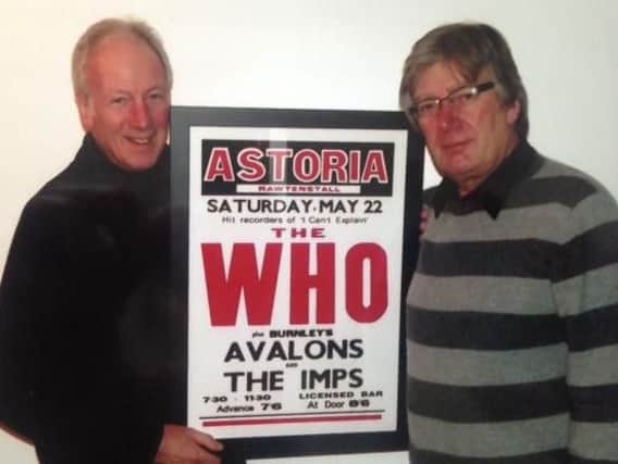 David Parkinson and Mike Guttridge holding the poster of The Who, a band The Avalons supported at the Astoria Ballroom in the early 1960's.