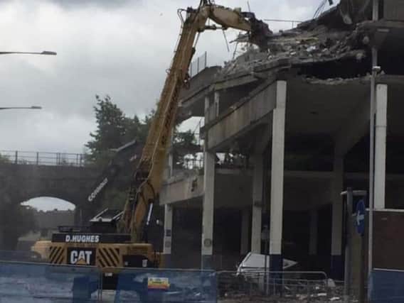 The old multi-storey car park is being knocked down