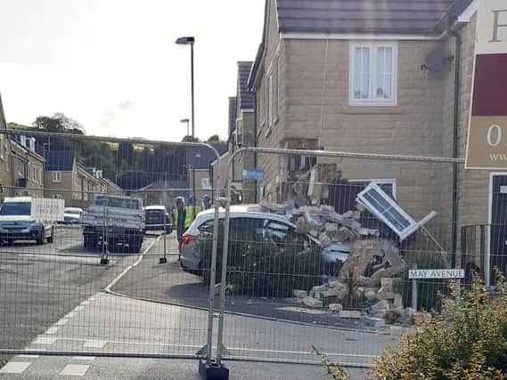 This image of the car that collided with the corner of a house was captured by Michelle Schofield-Cook in Burnley yesterday.