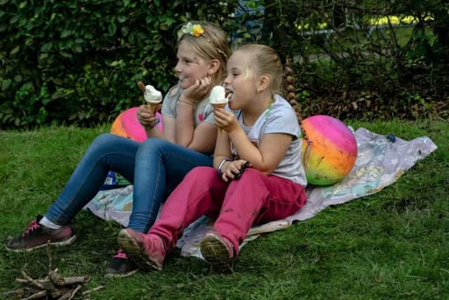 Two young revellers enjoy an ice cream at Padiham Community Festival (photo Ian Moore)