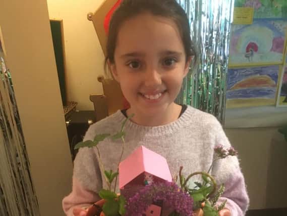 Nine-year-old Aine Salha won first prize with her miniature garden