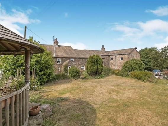 A gorgeous six-bedroom farmhouse, this Burnley property is on the market with GetAnOffer with price available on application.